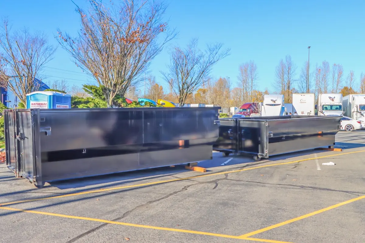 Professional dumpster rental service with roll-off container on residential driveway in Tucson Mountains